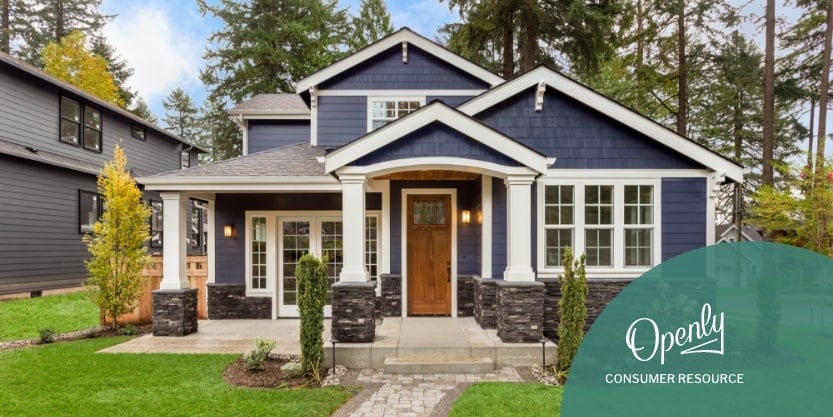 A photo of a two story blue and white house. 