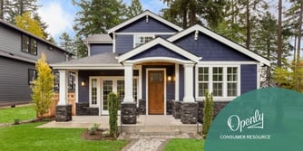 A photo of a two story blue and white house. 