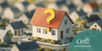 A model house with a yellow question mark embedded in a pitched red roof. 