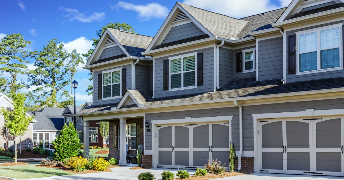 A neighborhood of gray townhomes. 